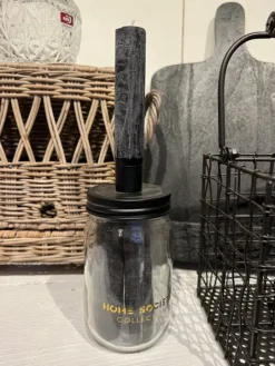 Glazen pot met 3 zwarte kaarsen