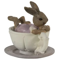 Konijnen meisje liggend in kop en schotel